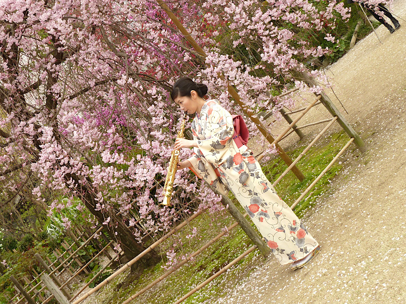 Kimono Woman playing instrument in Shukkeien Garden in Hiroshima