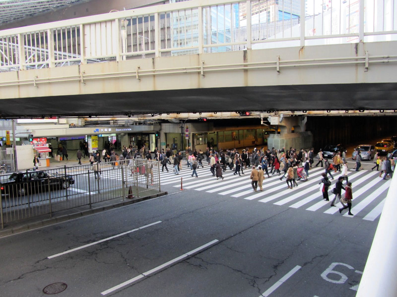 People crossing Street near Osaka Station
